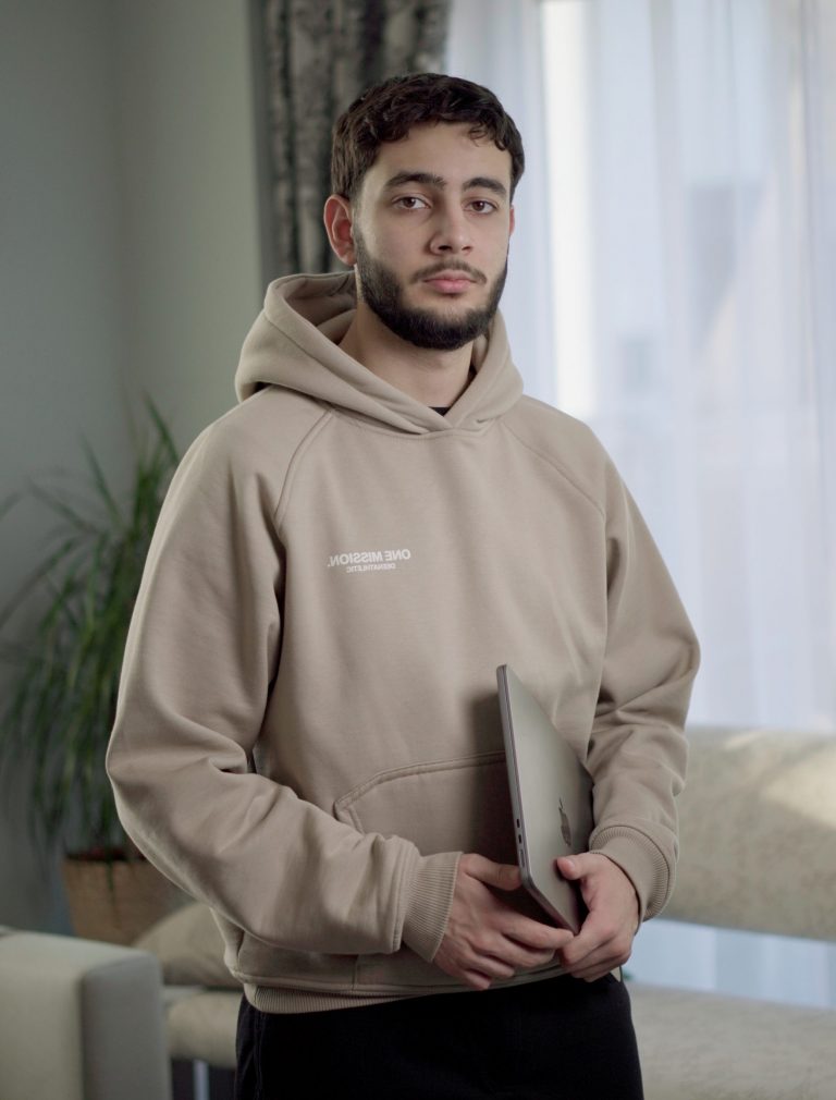 a man holding a laptop